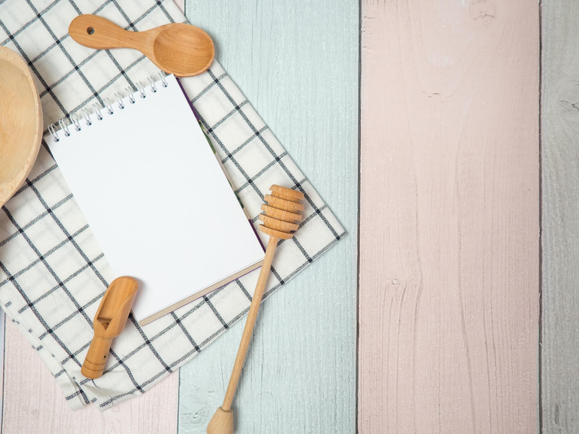 Flat lay of recipe cards and utensils